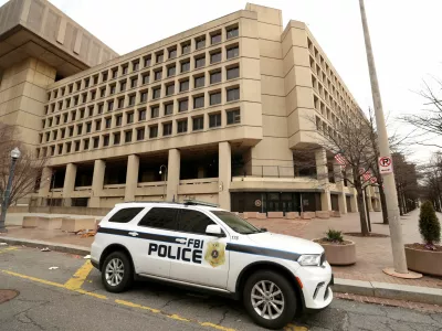 FILE PHOTO: An FBI police car stands outside FBI headquarters, days after the Trump administration launched a sweeping round of cuts at the Justice Department, in Washington, U.S., February 3, 2025. REUTERS/Kevin Lamarque/File Photo