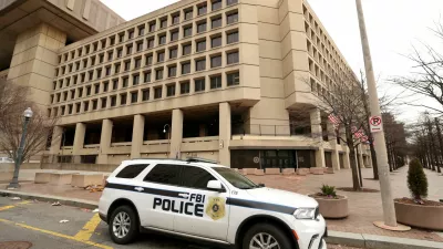 FILE PHOTO: An FBI police car stands outside FBI headquarters, days after the Trump administration launched a sweeping round of cuts at the Justice Department, in Washington, U.S., February 3, 2025. REUTERS/Kevin Lamarque/File Photo