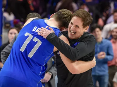 ﻿Nov 18, 2019; Dallas, TX, USA; Dallas Mavericks owner Mark Cuban hugs forward Luka Doncic (77) after the win over the San Antonio Spurs at the American Airlines Center. Mandatory Credit: Jerome Miron-USA TODAY Sports