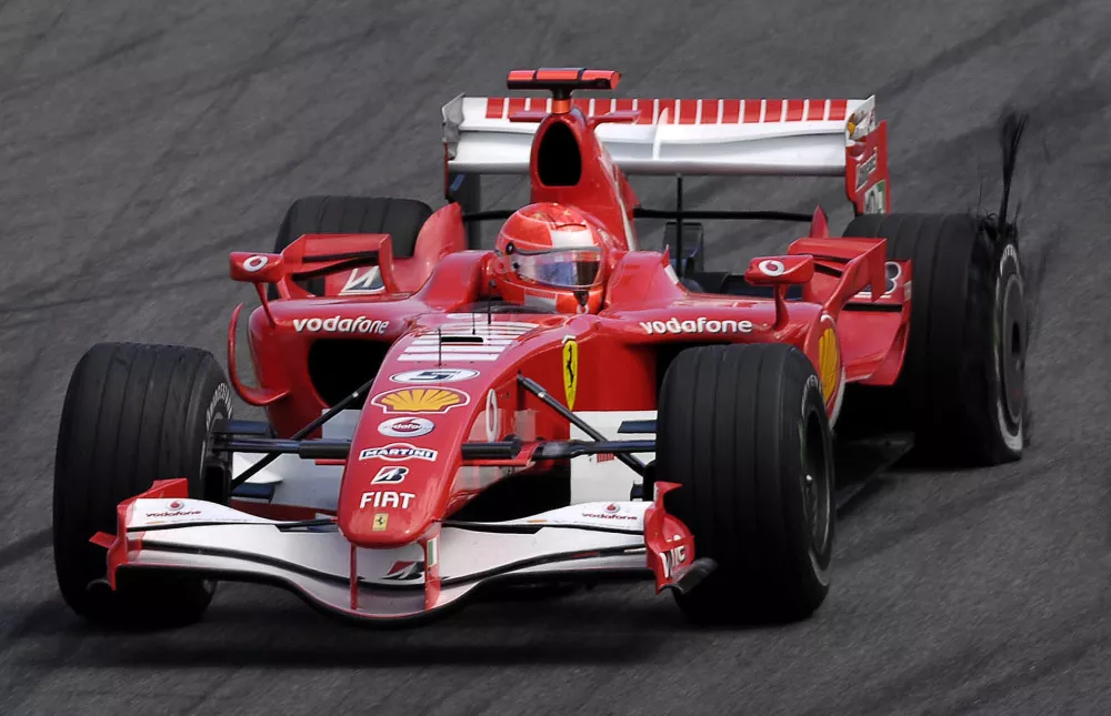 Germany's Michael Schumacher, drives his Ferrari with a flat tyre, rear right, during the Brazilian F1 Grand Prix at the Interlagos racetrack in Sao Paulo, Brazil, on Sunday, Oct. 22, 2006. Schumacher finished in fourth place. Schumacher ended his 16-year Formula One career in Sunday's Brazilian Formula One Grand Prix. (AP Photos/Media Images/Anna Kalagani) ** GREECE OUT **