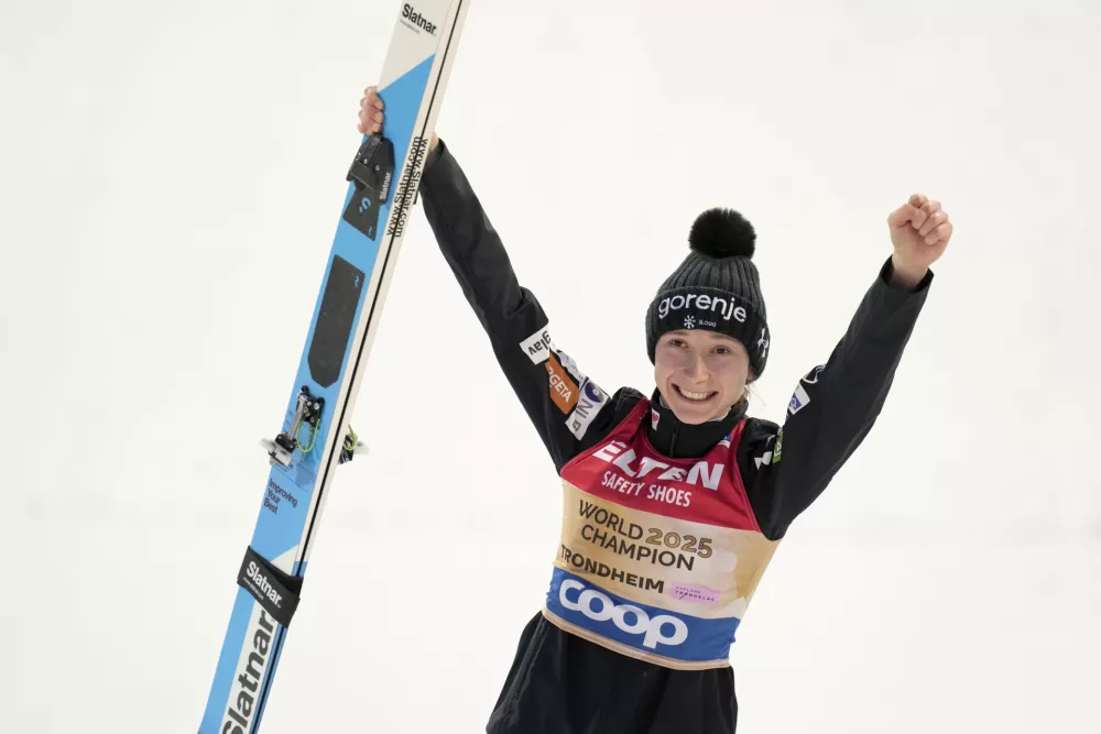 Nika Prevc, of Slovenia, celebrates after winning the gold medal in the ski jumping women's large hill individual competition at the Nordic World Ski Championships in Trondheim, Norway, Friday, March 7, 2025. (AP Photo/Matthias Schrader)