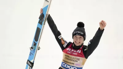 Nika Prevc, of Slovenia, celebrates after winning the gold medal in the ski jumping women's large hill individual competition at the Nordic World Ski Championships in Trondheim, Norway, Friday, March 7, 2025. (AP Photo/Matthias Schrader)