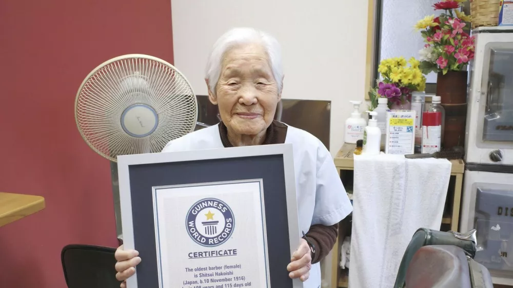 Shitsui Hakoishi, 108, poses for a photo with a Guiness World Records certificate recognizing her as the world's oldest female barber, at her shop in Nakagawa in Tochigi Prefecture, eastern Japan, on March 5, 2025.,Image: 972584007, License: Rights-managed, Restrictions:, Model Release: no