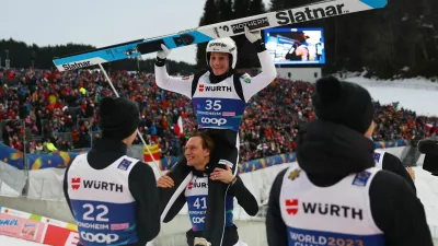 Nordic Skiing - FIS Nordic World Ski Championships - Trondheim, Norway - March 8, 2025 Slovenia's Domen Prevc celebrates winning the men's large hill alongside Slovenia's Anze Lanisek REUTERS/Kai Pfaffenbach