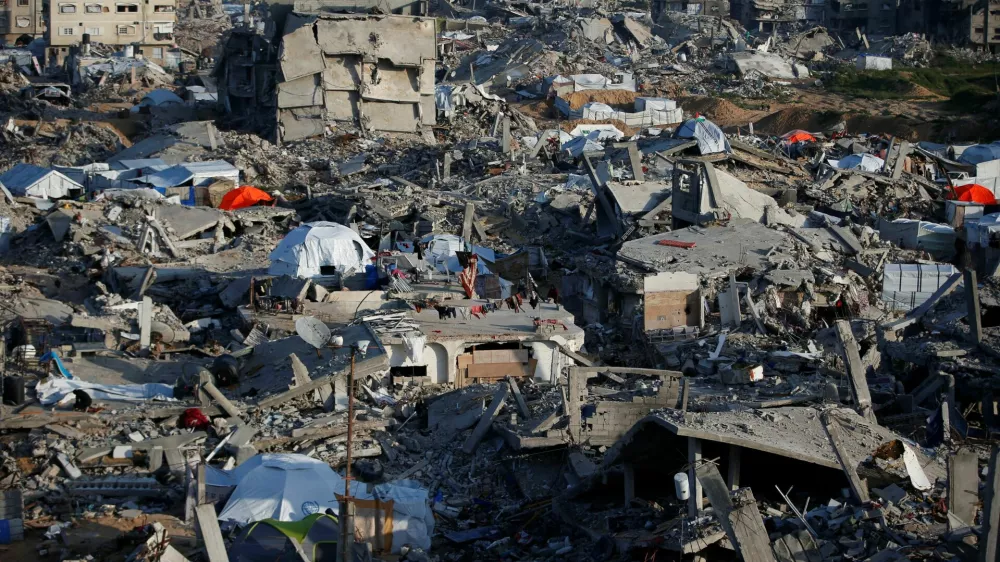 Tents are seen among the rubble of destroyed buildings, amid a ceasefire between Israel and Hamas, at Jabalia refugee camp, northern Gaza Strip, February 26, 2025. REUTERS/Mahmoud Issa