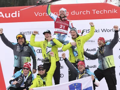 Third placed Slovenia's Miha Hrobat celebrates with the team after an alpine ski, men's World Cup downhill, in Kvitfjell, Norway, Saturday, March 8, 2025. (AP Photo/Marco Trovati)