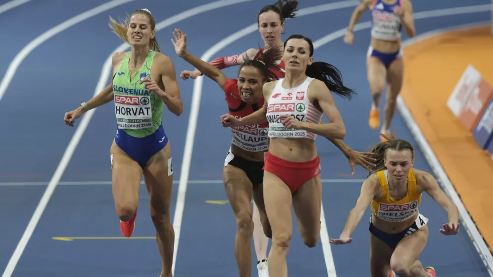 Slovenia's Anita Horvat, left, and Poland's Anna Wielgosz, center cross the finish line while Sweden's Wilma Nielsen falls during 800 meters semifinal during European Athletics Indoor Championships in Apeldoorn, Netherlands, Saturday, March 8, 2025. (AP Photo/Patrick Post)