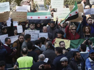 Activists protest against the recent wave of violence and sectarian attacks in Syria's coastal region, in Damascus, Syria, Sunday, March 9, 2025. (AP Photo/Omar Sanadiki)