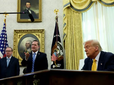 U.S. National Security Advisor Michael Waltz speaks next to U.S. President Donald Trump in the Oval Office of the White House in Washington, D.C., U.S., March 7, 2025. REUTERS/Leah Millis