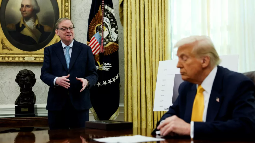 FILE PHOTO: White House economic adviser Kevin Hassett speaks next to U.S. President Donald Trump in the Oval Office of the White House in Washington, D.C., U.S., March 7, 2025. REUTERS/Leah Millis/File Photo