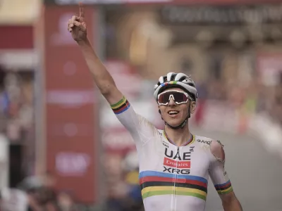 Tadej Pogačar riding for the UAE Team Emirates celebrates winning 19th edition of the Strade Bianche (White Roads) a 213 km one day race from Siena, Italy, Saturday March 8, 2025. (Marco AlpozziLaPresse via AP)