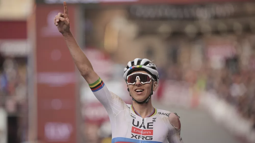 Tadej Pogačar riding for the UAE Team Emirates celebrates winning 19th edition of the Strade Bianche (White Roads) a 213 km one day race from Siena, Italy, Saturday March 8, 2025. (Marco AlpozziLaPresse via AP)