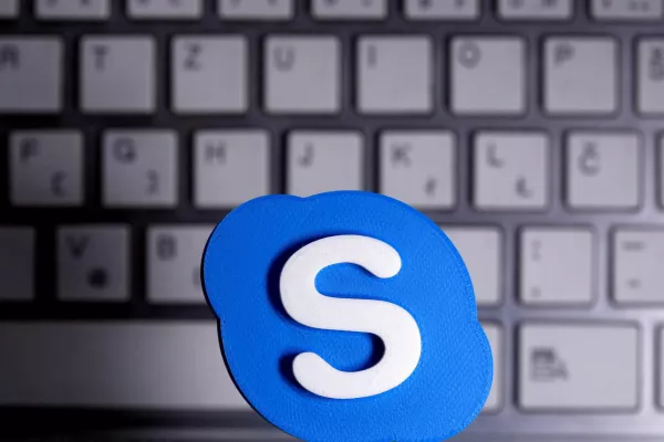 FILE PHOTO: A 3D printed Skype logo is placed in front of a keyboard in this illustration taken April 12, 2020. REUTERS/Dado Ruvic/Illustration/File Photo