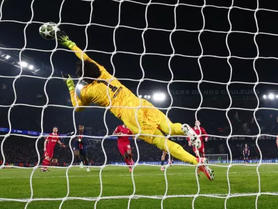 Soccer Football - Champions League - Round of 16 - First Leg - Paris St Germain v Liverpool - Parc des Princes, Paris, France - March 5, 2025 Liverpool's Alisson Becker makes a save REUTERS/Gonzalo Fuentes