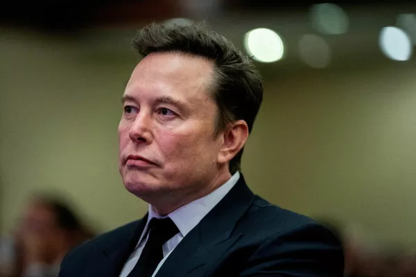 FILE PHOTO: Tesla CEO and X owner Elon Musk listens as US President-elect Donald Trump speaks during a meeting with House Republicans at the Hyatt Regency hotel in Washington, DC, U.S. on November 13, 2024. ALLISON ROBBERT/Pool via REUTERS/File Photo