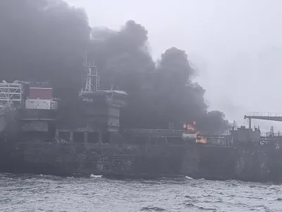 In this image taken from video provided by Denys Mezentsev, rescue crews work on site after a cargo ship was hit by a tanker carrying jet fuel for the U.S. military off eastern England, Monday, March 10, 2025, setting both vessels ablaze and sending fuel pouring into the North Sea. (Denys Mezentsev via AP)