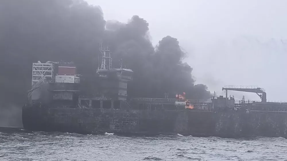 In this image taken from video provided by Denys Mezentsev, rescue crews work on site after a cargo ship was hit by a tanker carrying jet fuel for the U.S. military off eastern England, Monday, March 10, 2025, setting both vessels ablaze and sending fuel pouring into the North Sea. (Denys Mezentsev via AP)