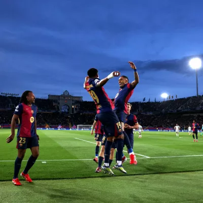 Soccer Football - Champions League - Round of 16 - Second Leg - FC Barcelona v Benfica - Estadi Olimpic Lluis Companys, Barcelona, Spain - March 11, 2025 FC Barcelona's Raphinha celebrates scoring their first goal with Lamine Yamal REUTERS/Albert Gea   TPX IMAGES OF THE DAY