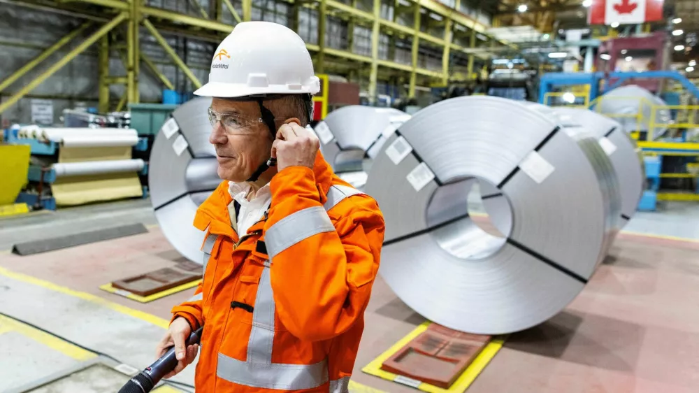 Canada's Prime Minister-designate Mark Carney prepares to speak to workers while he visits the ArcelorMittal Dofasco steel mill in Hamilton, Ontario, Canada March 12, 2025. REUTERS/Carlos Osorio   TPX IMAGES OF THE DAY