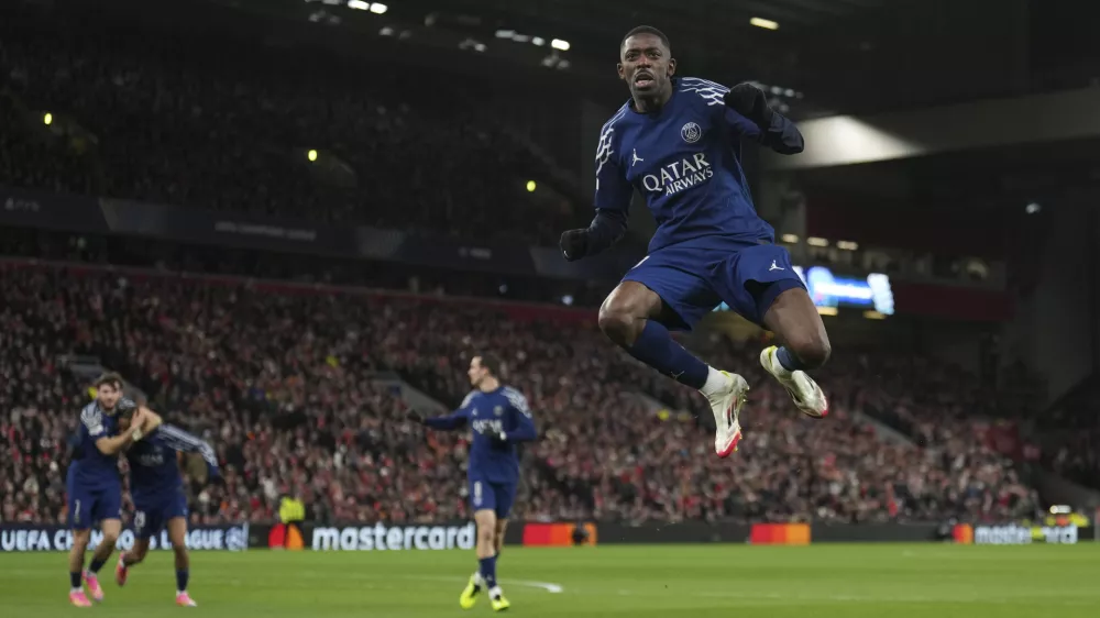 PSG's Ousmane Dembele celebrates after scoring during the Champions League round of 16 second leg soccer match between Liverpool and Paris Saint-Germain at Anfield in Liverpool, England, Tuesday, March 11, 2025. (AP Photo/Jon Super)