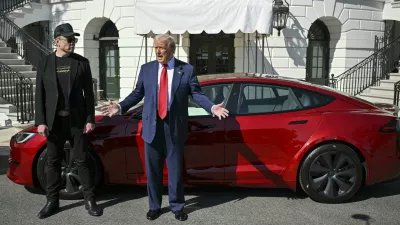 President Donald Trump and Tesla CEO Elon Musk speak to reporters near a red Model S Tesla vehicle on the South Lawn of the White House Tuesday, March 11, 2025, in Washington. (Pool via AP)