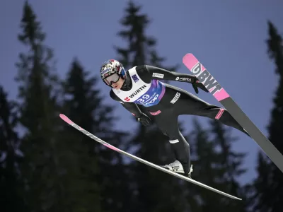 Marius Lindvik, of Norway, soars through the air during his first round jump of the ski jumping men's normal hill HS102 event at the Nordic World Ski Championships in Trondheim, Norway, Sunday, March 2, 2025. (AP Photo/Matthias Schrader)