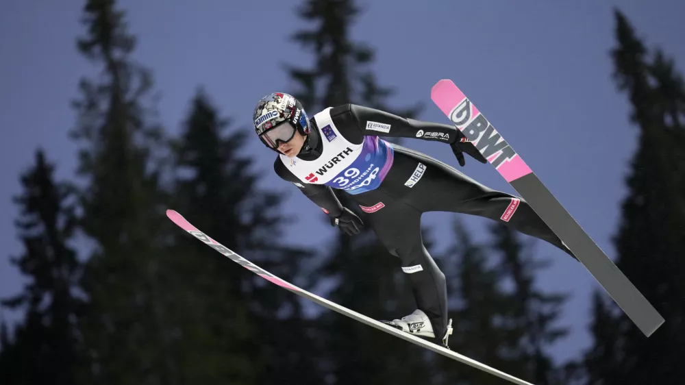 Marius Lindvik, of Norway, soars through the air during his first round jump of the ski jumping men's normal hill HS102 event at the Nordic World Ski Championships in Trondheim, Norway, Sunday, March 2, 2025. (AP Photo/Matthias Schrader)