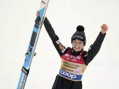 Nika Prevc, of Slovenia, celebrates after winning the gold medal in the ski jumping women's large hill individual competition at the Nordic World Ski Championships in Trondheim, Norway, Friday, March 7, 2025. (AP Photo/Matthias Schrader)