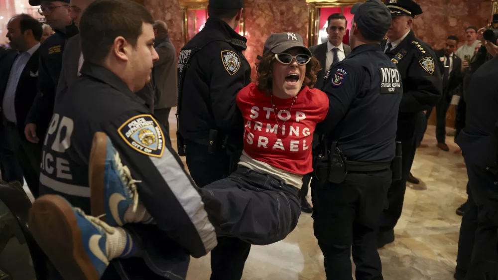 New York Police officers arrest a demonstrator from the group, Jewish Voice for Peace, who protested inside Trump Tower in support of Columbia graduate student Mahmoud Khalil, Thursday, March 13, 2025, in New York. (AP Photo/Yuki Iwamura)