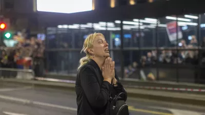 Dijana Hrka, mother of a young man killed in a train station canopy collapse, cries as she attends a protest ahead of a major anti-corruption rally this weekend, in Belgrade, Serbia, Friday, March 14, 2025. (AP Photo/Marko Drobnjakovic)