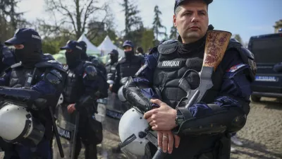 Police officers stand guard prior to a an anti-corruption rally in Belgrade, Serbia, Saturday, March 15, 2025. (AP Photo/Armin Durgut)