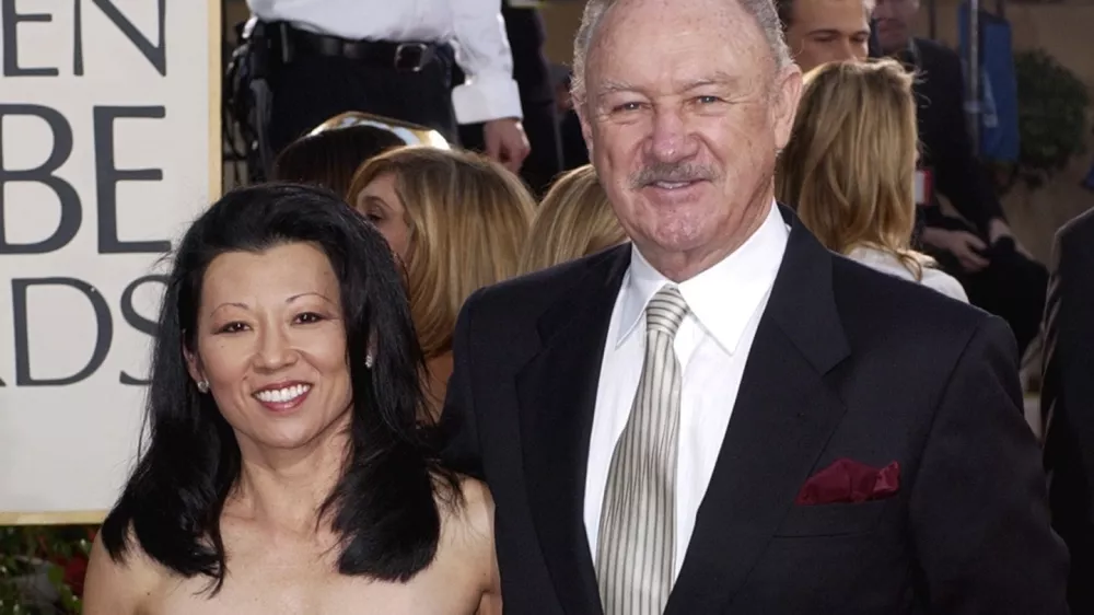 FILE - Actor Gene Hackman arrives with his wife, Betsy Arakawa, for the 60th Annual Golden Globe Awards in Beverly Hills, Calif., Sunday, Jan. 19, 2003. (AP Photo/Mark J. Terrill, File)