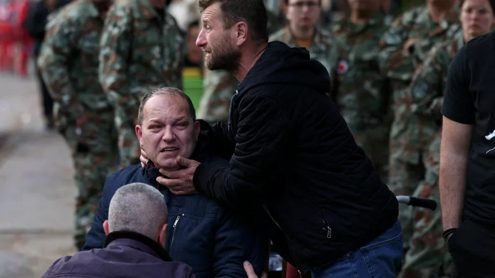 People react outside a hospital, following a fire in a night club resulting in casualties, in the town of Kocani, North Macedonia, March 16, 2025. REUTERS/Alexandros Avramidis   TPX IMAGES OF THE DAY