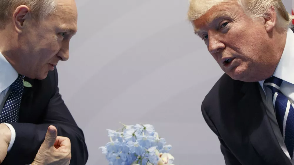 FILE – U.S. President Donald Trump, right, meets with Russian President Vladimir Putin at the G20 Summit in Hamburg, Germany, July 7, 2017. (AP Photo/Evan Vucci, File)