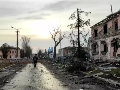 A Russian service member walks past destroyed buildings in the town of Sudzha, which was recently retaken by Russia's armed forces in the course of Russia-Ukraine conflict in the Kursk region, Russia, in this still image from video released March 15, 2025. Russian Defence Ministry/Handout via REUTERS ATTENTION EDITORS - THIS IMAGE HAS BEEN SUPPLIED BY A THIRD PARTY. NO RESALES. NO ARCHIVES. MANDATORY CREDIT.