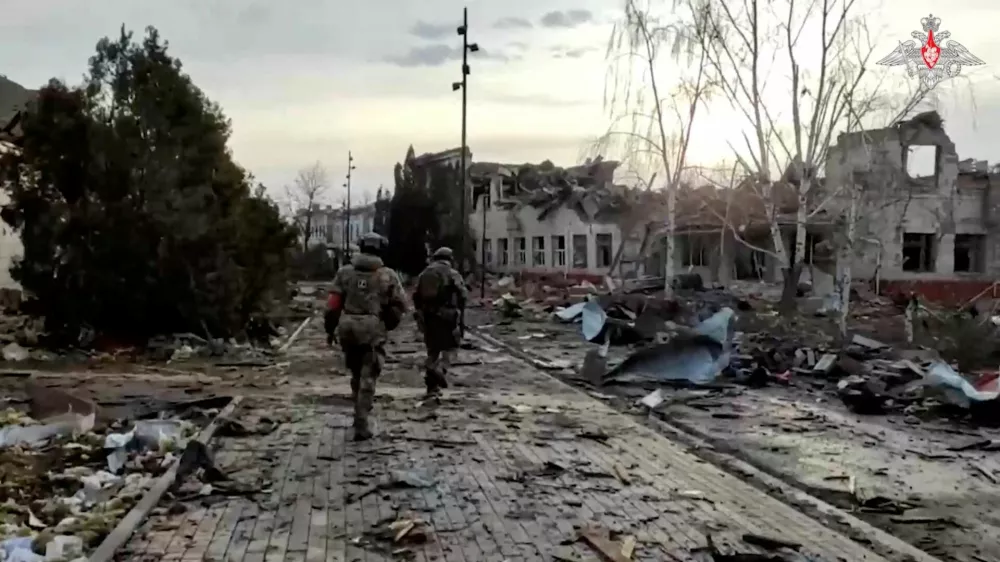 FILE PHOTO: Russian service members walk past a destroyed building in the town of Sudzha, which was recently retaken by Russia's armed forces in the course of Russia-Ukraine conflict in the Kursk region, Russia, in this still image from video released March 15, 2025. Russian Defence Ministry/Handout via REUTERS ATTENTION EDITORS - THIS IMAGE HAS BEEN SUPPLIED BY A THIRD PARTY. NO RESALES. NO ARCHIVES. MANDATORY CREDIT./File Photo