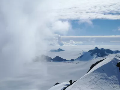 ﻿In this 2011 photo provided by researcher Hamish Pritchard, summer clouds swirl around the Staccato Peaks of Alexander Island off the Antarctic Peninsula. In a study released Wednesday, June 13, 2018, an international team of ice experts said the melting of Antarctica is accelerating at an alarming rate, with about 3 trillion tons of ice disappearing since 1992.Â â€¨(Hamish Pritchard/British Antarctic Survey via AP)