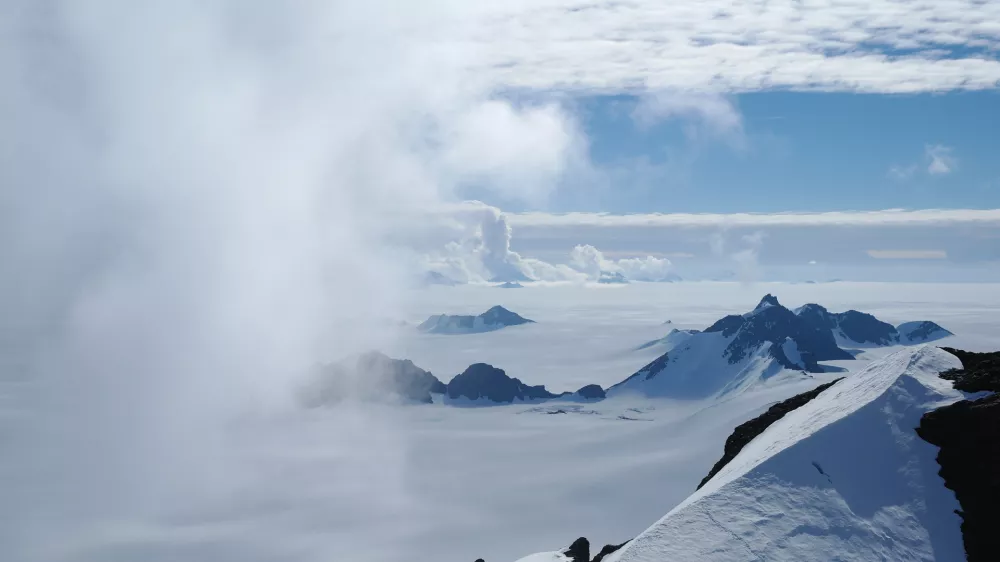 ﻿In this 2011 photo provided by researcher Hamish Pritchard, summer clouds swirl around the Staccato Peaks of Alexander Island off the Antarctic Peninsula. In a study released Wednesday, June 13, 2018, an international team of ice experts said the melting of Antarctica is accelerating at an alarming rate, with about 3 trillion tons of ice disappearing since 1992.Â â€¨(Hamish Pritchard/British Antarctic Survey via AP)