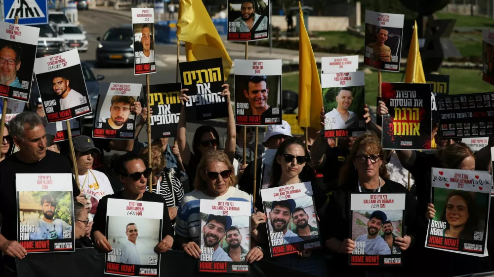 Family members and supporters of hostages stand outside the Knesset, the Israeli parliament, during a statement to the press demanding the return of all hostages kidnapped during the deadly October 7, 2023 attack by Hamas, in Jerusalem, March 18, 2025. REUTERS/Ronen Zvulun