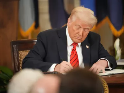 20 March 2025, US, Washington: US President Donald Trump signs an executive order to start the elimination of the Department of Education during an East Room ceremony on March 20, 2025. Trump was joined by a number of governors and school children as he signed the executive order. Photo: Andrew Leyden/ZUMA Press Wire/dpa