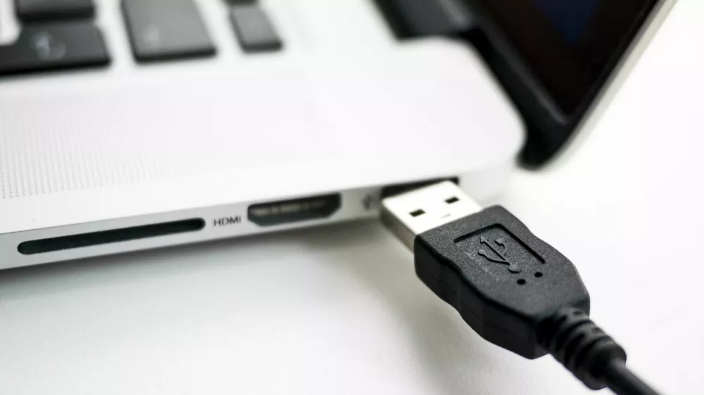 ﻿A photo illustration shows a USB device being plugged into a laptop computer in Berlin July 31, 2014. USB devices such as mice, keyboards and thumb-drives can be used to hack into personal computers in a potential new class of attacks that evade all known security protections, German crypto specialist and chief scientist with Berlin's SR Labs Karsten Nohl revealed on Thursday.  REUTERS/Thomas Peter (GERMANY - Tags: CRIME SCIENCE TECHNOLOGY)
