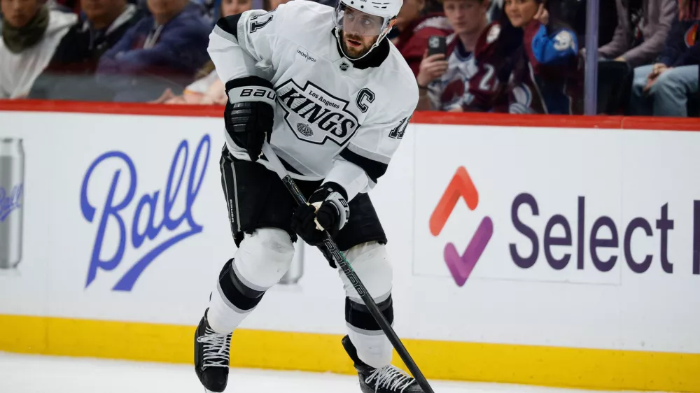 Mar 27, 2025; Denver, Colorado, USA; Los Angeles Kings center Anze Kopitar (11) controls the puck in the first period against the Colorado Avalanche at Ball Arena. Mandatory Credit: Isaiah J. Downing-Imagn Images