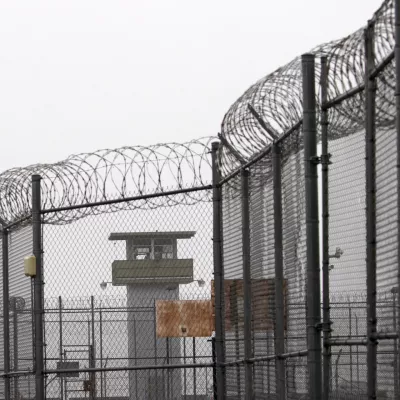 FILE - A guard tower and barbed wire fencing stand outside Sing Sing, Sunday, Feb. 16, 2020 in Ossining, N.Y. (AP Photo/Mark Lennihan, File)