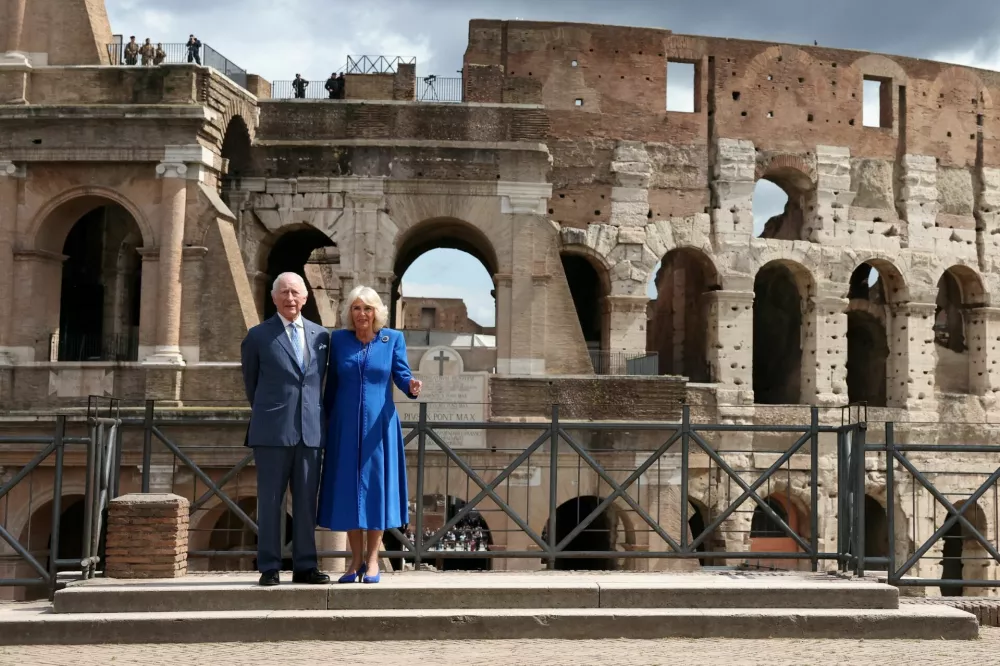Britain's King Charles and Queen Camilla pose during a visit to the Colosseum in Rome, Italy, April 8, 2025. REUTERS/Phil Noble/Pool