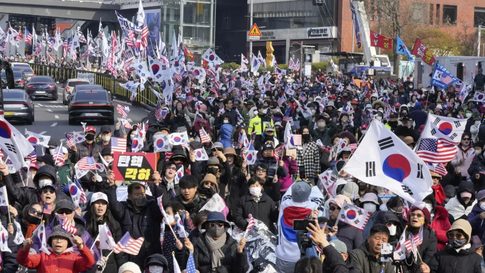 Supporters of impeached South Korean President Yoon Suk Yeol stage a rally to oppose his impeachment near the presidential residence in Seoul, South Korea, Friday, April 4, 2025. (AP Photo/Ahn Young-joon)