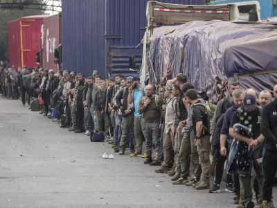 Captured Romanian mercenaries, who were fighting alongside Democratic Republic of Congo army (FRDC), wait to be released by M23 rebels at Gisenyi border point in Congo, Wednesday, Jan. 29, 2025, after the M23 rebels advanced into eastern Congo's capital Goma. (AP Photo/Brian Inganga)
