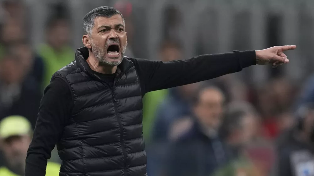 AC Milan's head coach Sergio Conceicao calls out to his players during an Italian Cup semi final first leg soccer match between AC Milan and Inter Milan at the San Siro stadium, in Milan, Italy, Wednesday, April 2, 2025. (AP Photo/Antonio Calanni)