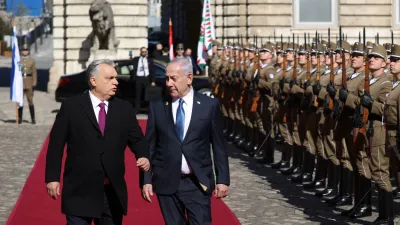 Hungarian Prime Minister Viktor Orban and Israeli Prime Minister Benjamin Netanyahu walk on the red carpet during a welcoming ceremony at the Lion's Courtyard in Budapest, Hungary, April 3, 2025. REUTERS/Bernadett Szabo