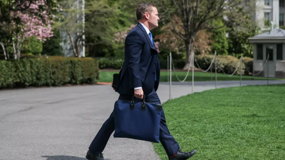 U.S. National Security Advisor Mike Waltz walks to board Marine One, in Washington, D.C., U.S., April 3, 2025. REUTERS/Carlos Barria
