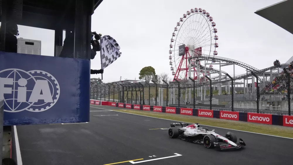 Red Bull driver Max Verstappen of the Netherlands receives the checkered flag as he crosses the finish line to win the Japanese Formula One Grand Prix at the Suzuka Circuit in Suzuka, central Japan, Sunday, April 6, 2025. (AP Photo/Shuji Kajiyama, Pool)